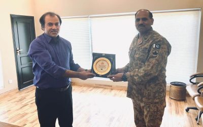 Presenting souvenir to Brig Amir Rashid Station Commander.